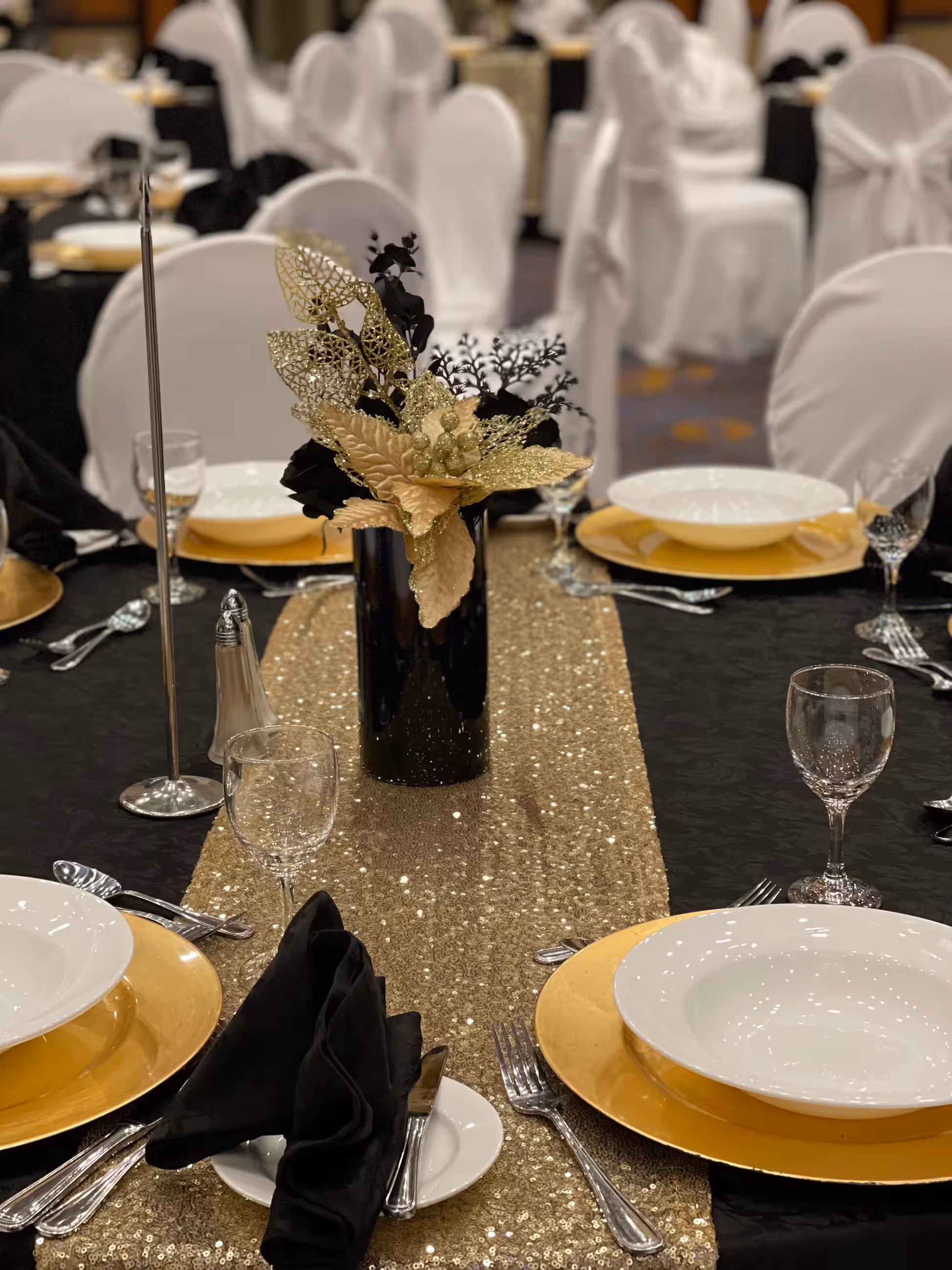 Black gold floral centerpiece elegant table setting