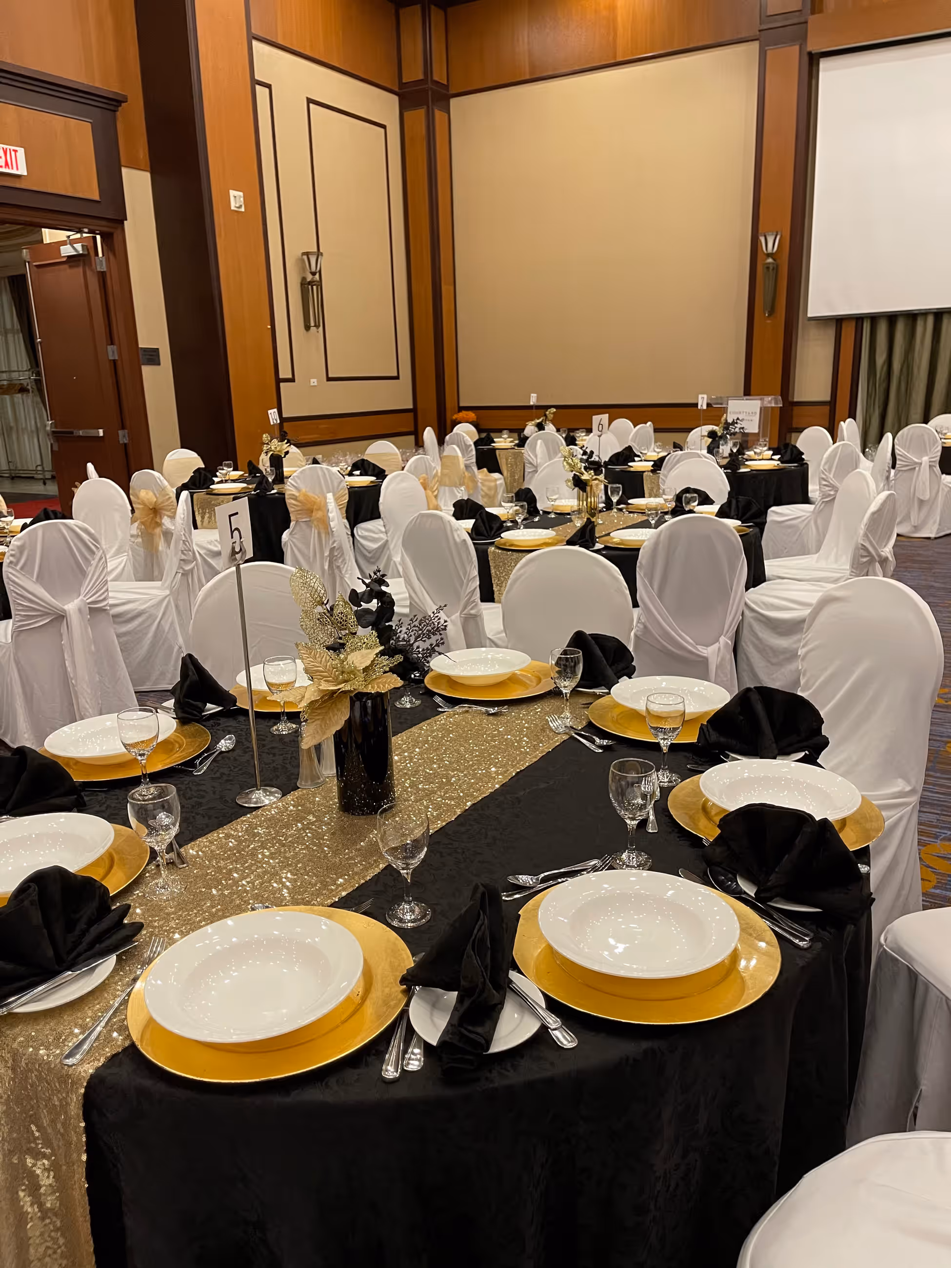 Black gold gala table setting ballroom