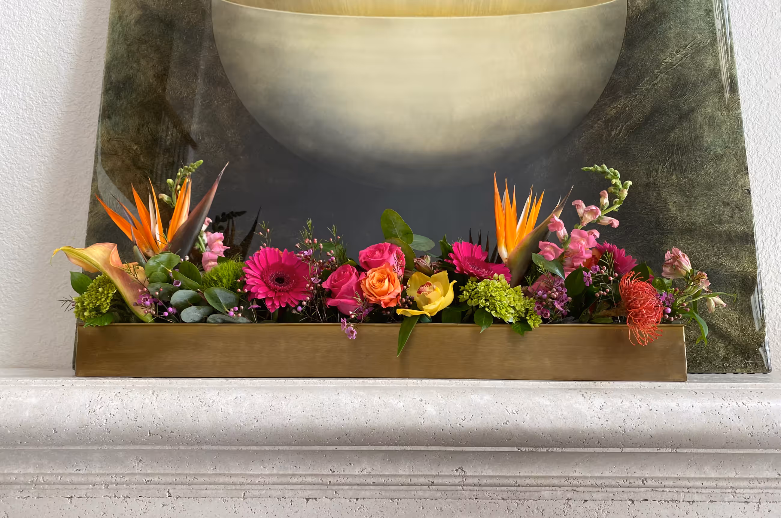 Pink orange bird of paradise tropical mantel arrangement
