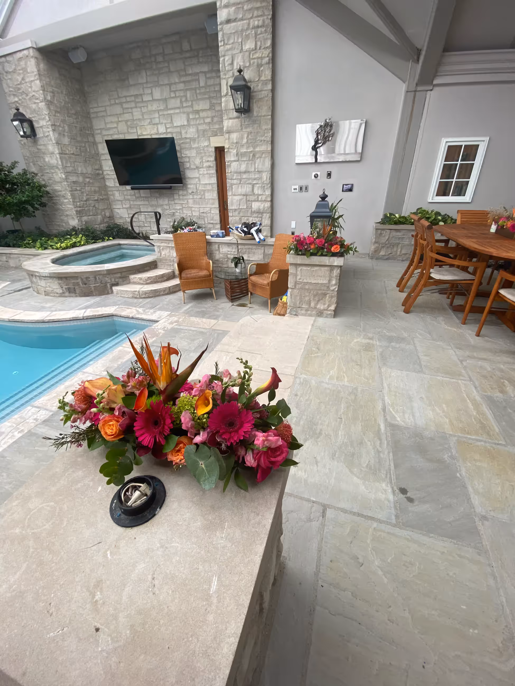 Pink orange tropical floral arrangement poolside