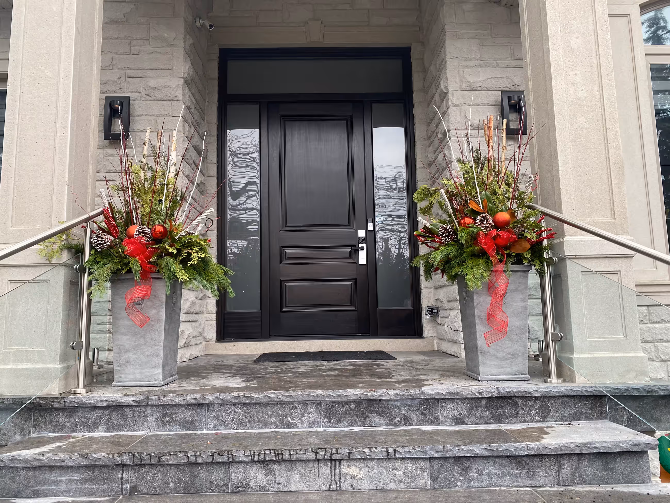 Red christmas urn pair staircase entrance