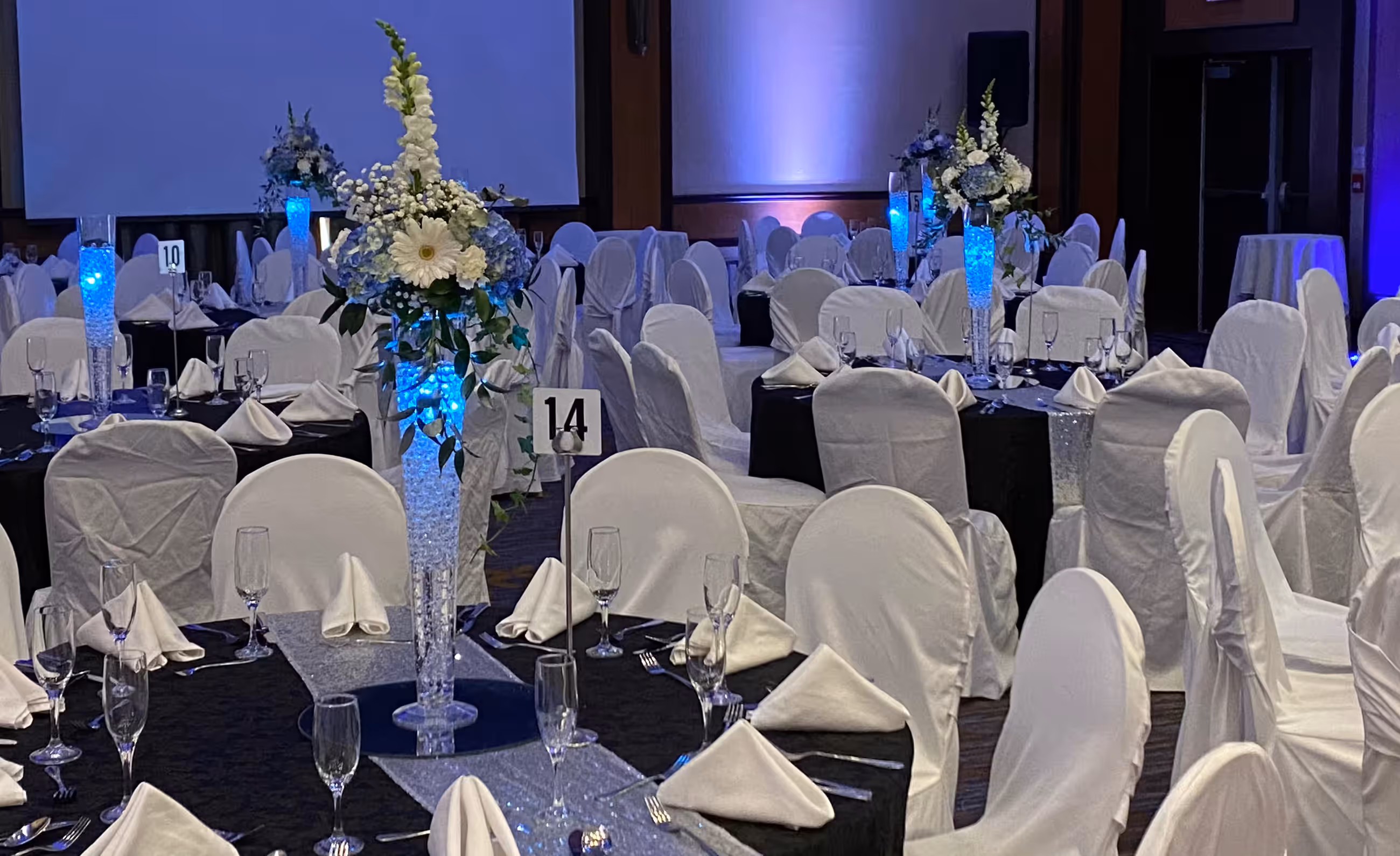 Tall blue white floral centerpieces ballroom wide
