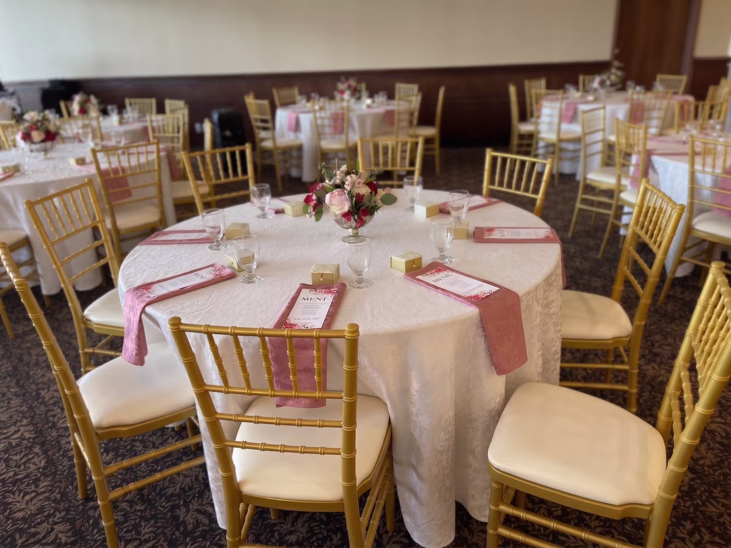 Pink floral gold chair table setting