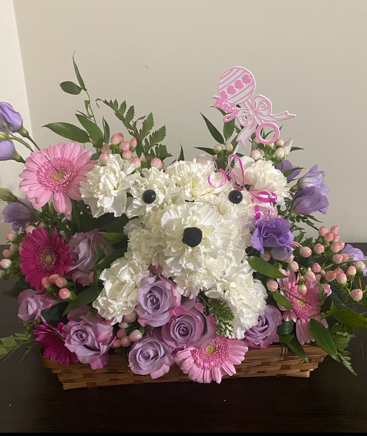 Pretty Paws floral puppy arrangement handcrafted in a decorative basket
