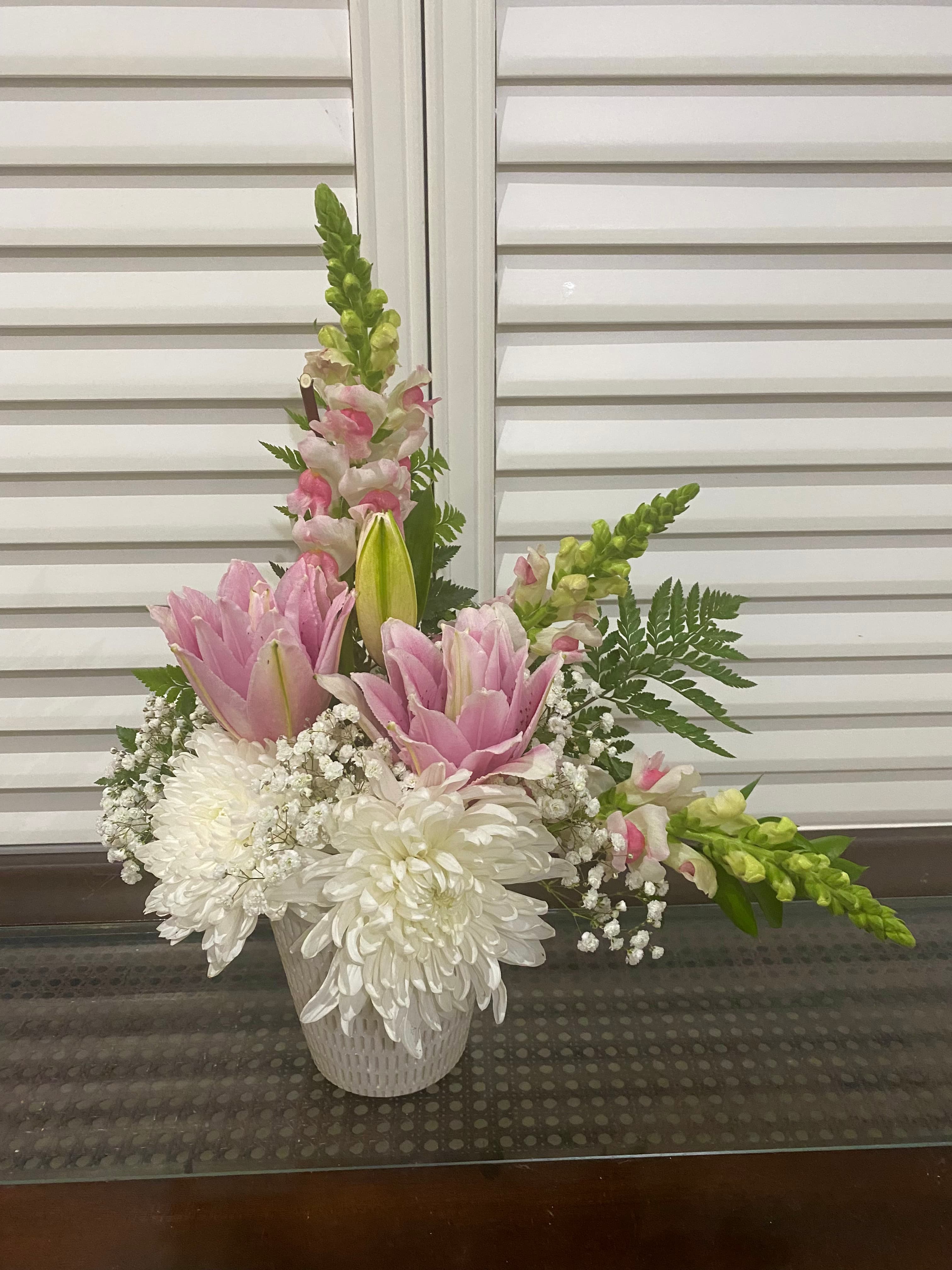 Simply Elegant arrangement with pink snapdragons, lily roses, white chrysanthemums, and greenery