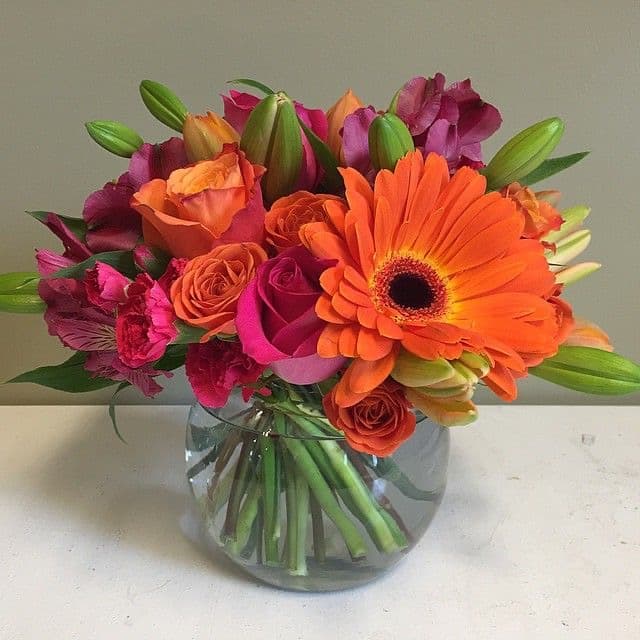 Spring Bright arrangement with roses, gerbera daisies, lilies, and alstroemeria
